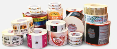 Packaging designers reviewing printed labels and carton mockups